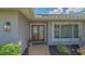 Elegant double front doors with glass inserts and decorative landscaping at 452 Picasso Dr, Nokomis, FL 34275