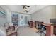 Home office with French doors, dual ceiling fans, and 2 desks at 452 Picasso Dr, Nokomis, FL 34275