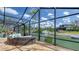 Enjoy the screened patio with seating overlooking a picturesque waterfront view at 452 Picasso Dr, Nokomis, FL 34275