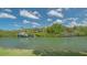 Picturesque canal front view with lush landscaping, private docks and boat, creating a serene setting at 452 Picasso Dr, Nokomis, FL 34275