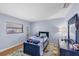 Blue-toned bedroom with dinosaur décor and light wood floors at 4806 Huntleigh Dr, Sarasota, FL 34233