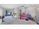 Large living room featuring glass sliders with views to the pool at 4806 Huntleigh Dr, Sarasota, FL 34233