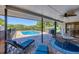Covered patio with outdoor furniture, dining table set, and a view of the pool at 4806 Huntleigh Dr, Sarasota, FL 34233