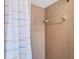 Close up of a shower with neutral tile and curtain rod at 4806 Huntleigh Dr, Sarasota, FL 34233