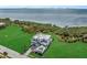 Breathtaking aerial view of waterfront home with expansive yard and private dock at 5210 Inspiration Ter, Bradenton, FL 34210