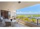 Outdoor balcony with a scenic view of a golf course and distant city skyline, perfect for relaxing and entertaining at 535 Sanctuary Dr # A602, Longboat Key, FL 34228