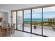 Balcony with ocean view and outdoor dining area at 535 Sanctuary Dr # A602, Longboat Key, FL 34228