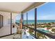 Spectacular view of the ocean, pool, and palm trees from the spacious balcony at 535 Sanctuary Dr # A602, Longboat Key, FL 34228