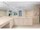 Elegant bathroom with double sinks, vanity area, and large mirror at 535 Sanctuary Dr # A602, Longboat Key, FL 34228