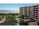 Beautiful beachfront condo building with multiple balconies overlooking the ocean at 535 Sanctuary Dr # A602, Longboat Key, FL 34228