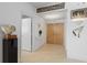 Inviting hallway with neutral tile flooring and modern lighting at 535 Sanctuary Dr # A602, Longboat Key, FL 34228