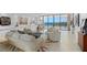 Bright and airy living room with ocean view and comfortable seating area at 535 Sanctuary Dr # A602, Longboat Key, FL 34228