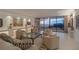 Bright and airy living room with ocean view and comfortable seating area at 535 Sanctuary Dr # A602, Longboat Key, FL 34228