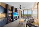 Inviting living room features a ceiling fan and sliding glass doors that open to a balcony at 535 Sanctuary Dr # A602, Longboat Key, FL 34228
