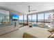 Bright main bedroom with ocean views, comfortable seating, and elegant decor at 535 Sanctuary Dr # A602, Longboat Key, FL 34228