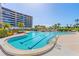 A stunning pool with 6 ft depth markers that is surrounded by palm trees and seating at 535 Sanctuary Dr # A602, Longboat Key, FL 34228