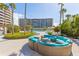 Outdoor lounge area features a pool and comfortable seating perfect for relaxation at 535 Sanctuary Dr # A602, Longboat Key, FL 34228