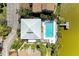 Aerial view shows a luxurious pool overlooking the lake, offering privacy and stunning water views at 5395 Lake Arrowhead Trl # 24, Sarasota, FL 34231