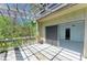 Outdoor balcony with wood pergola and sliding glass doors to indoor living space at 5395 Lake Arrowhead Trl # 24, Sarasota, FL 34231