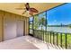 Screened balcony provides serene water views and a ceiling fan for comfortable outdoor enjoyment at 5395 Lake Arrowhead Trl # 24, Sarasota, FL 34231
