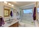 Well-lit bathroom features a shower-over-tub with glass doors, vanity with framed mirror, and modern fixtures at 5395 Lake Arrowhead Trl # 24, Sarasota, FL 34231