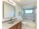 Elegant bathroom features a granite vanity and glass shower with marble tile surround at 5395 Lake Arrowhead Trl # 24, Sarasota, FL 34231