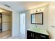 Bright bathroom features a vessel sink, sleek vanity and view to the outdoor patio at 5395 Lake Arrowhead Trl # 24, Sarasota, FL 34231