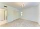 Bedroom with carpet, closet, overhead chandelier and bright windows at 5395 Lake Arrowhead Trl # 24, Sarasota, FL 34231