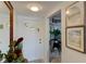 Bright entryway with unique door, tiled floor, decor and view into the kitchen and dining area at 5395 Lake Arrowhead Trl # 24, Sarasota, FL 34231