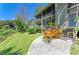 Multi-level condo exterior showcasing screened patios, lush landscaping, and a winding walkway at 5395 Lake Arrowhead Trl # 24, Sarasota, FL 34231