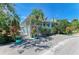 Charming home exterior with a cozy porch, lush plants, and a well-maintained yard, blending comfort and style at 5395 Lake Arrowhead Trl # 24, Sarasota, FL 34231