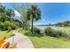 Scenic walking path near the lake, surrounded by lush landscaping and mature trees at 5395 Lake Arrowhead Trl # 24, Sarasota, FL 34231