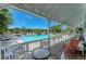 Covered porch provides scenic views of the pool, offering a relaxing outdoor space for leisure and entertainment at 5395 Lake Arrowhead Trl # 24, Sarasota, FL 34231