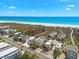 Aerial view of houses near a beach with beautiful ocean and blue sky at 548 Beach Rd # 540A, Sarasota, FL 34242