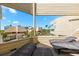 Spacious balcony seating features distant tropical landscape views, offering a delightful retreat at 548 Beach Rd # 540A, Sarasota, FL 34242