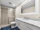 Modern bathroom with a sleek vanity, marble countertop, and a glass-enclosed shower for a spa-like experience at 548 Beach Rd # 540A, Sarasota, FL 34242
