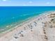 Beautiful view of the beach and ocean with plenty of people enjoying the sand and surf at 548 Beach Rd # 540A, Sarasota, FL 34242
