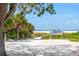 Sandy path leads to Siesta Beach, ranked #1, bordered by lush greenery and featuring a view of the ocean at 548 Beach Rd # 540A, Sarasota, FL 34242