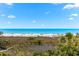 Expansive beach view featuring white sand, turquoise water, and clear blue skies, perfect for relaxing at 548 Beach Rd # 540A, Sarasota, FL 34242