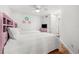 Bright bedroom offers two beds, hardwood floors, and ceiling fan, creating a peaceful retreat at 548 Beach Rd # 540A, Sarasota, FL 34242