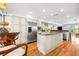 Spacious kitchen featuring stainless steel appliances, an island, hardwood floors, and plenty of natural light at 548 Beach Rd # 540A, Sarasota, FL 34242