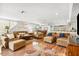 A spacious living room features hardwood floors and comfortable seating arrangements at 548 Beach Rd # 540A, Sarasota, FL 34242