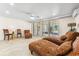 Bright living room with comfortable seating, tile floors, and plenty of natural light from large windows at 548 Beach Rd # 540A, Sarasota, FL 34242