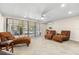 Spacious room features comfortable seating, large windows, and tile flooring, perfect for relaxation at 548 Beach Rd # 540A, Sarasota, FL 34242
