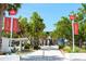 A park entrance framed by lush greenery with the Siesta Beach sign and beautiful landscaping at 548 Beach Rd # 540A, Sarasota, FL 34242