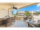 A comfortable patio has beautiful wicker furniture and an ocean view at 548 Beach Rd # 540A, Sarasota, FL 34242