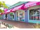 Charming retail storefronts featuring colorful awnings and decorative details, creating a vibrant shopping atmosphere at 548 Beach Rd # 540A, Sarasota, FL 34242