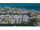 Stunning aerial view of a waterfront community with canals, homes, and easy access to the open water at 606 Emerald Ln, Holmes Beach, FL 34217