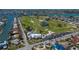 Breathtaking aerial view of a waterfront community with a golf course and canal access for boating at 606 Emerald Ln, Holmes Beach, FL 34217