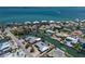 Overhead view showcasing waterfront homes on canals near the ocean at 606 Emerald Ln, Holmes Beach, FL 34217